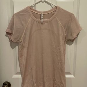 blush colored Swiftly Tech short sleeve shirt